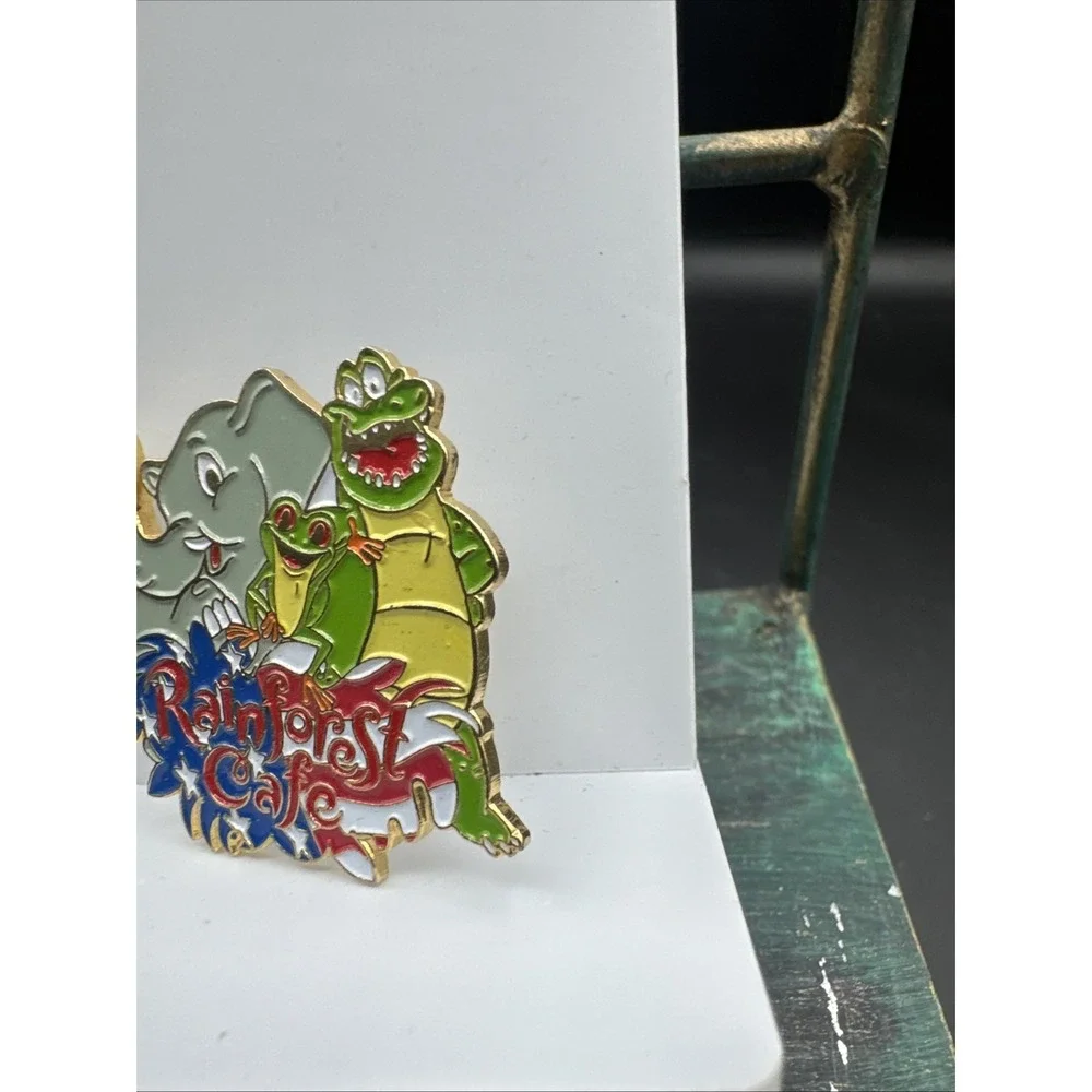 Rainforest Cafe Pin Featuring Nike, Cha Cha, Tuki American Flag